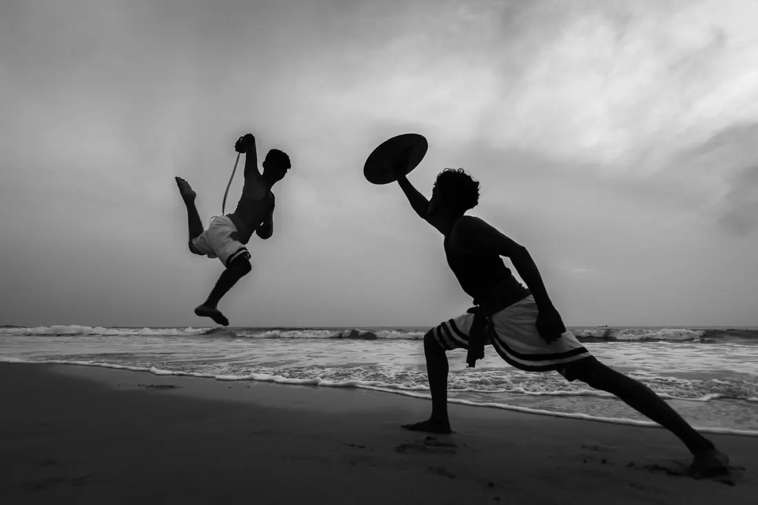 Kalaripayattu practitioners demonstrating the Kerala martial art with weapons